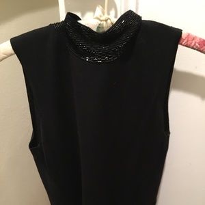 Sleeveless black fancy turtleneck